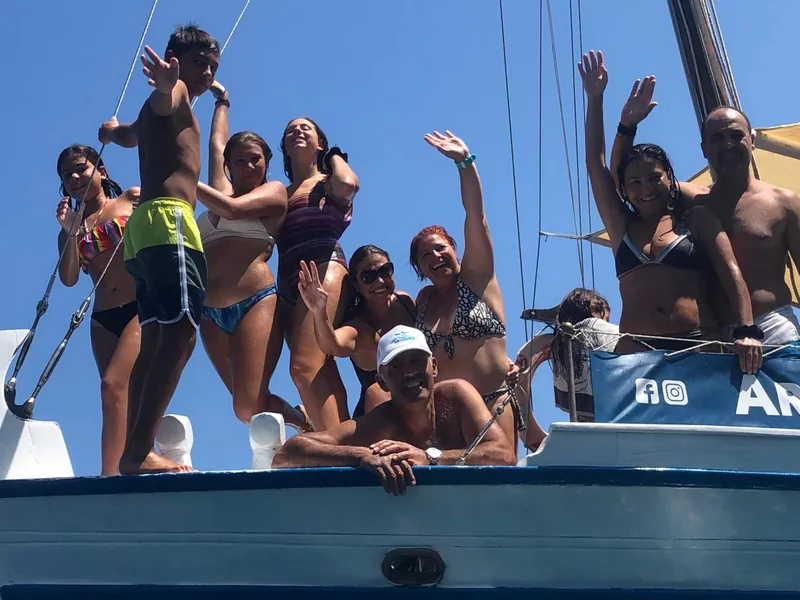 A group waving from the bow