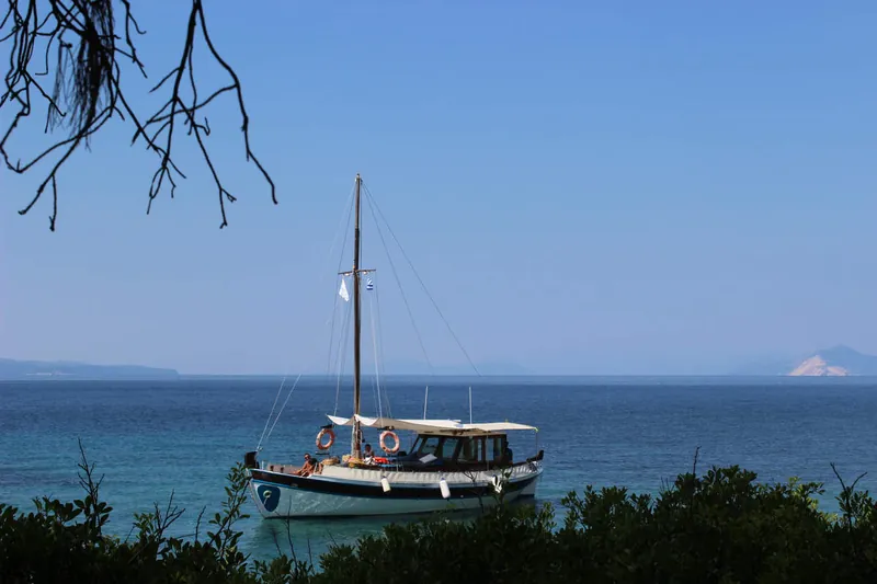 Artemida anchored in a quiet bay